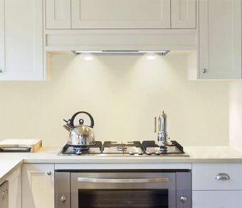 A kitchen side view of the IKTCH IKB02-36 36 Range Hood Insert 36 Range Hood Insert for our Top 3 Best 36 Range Hood Insert 2023 listicle. The range hood is installed in a kitchen.