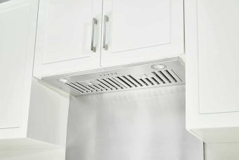 A kitchen view of the KOBE INX2936SQBF-500-2 36 Range Hood Insert for our Top 3 Best 36 Range Hood Insert 2023 listicle. The range hood is installed in a kitchen.