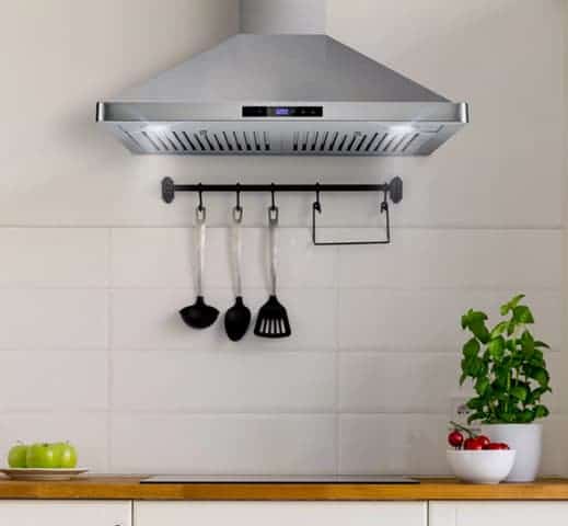 A kitchen side view of the Cosmo 63175S (30") Chimney Range Hood for our Top 5 Wall Mount Chimney Range Hoods of 2022 listicle. The range hood is installed in a kitchen.