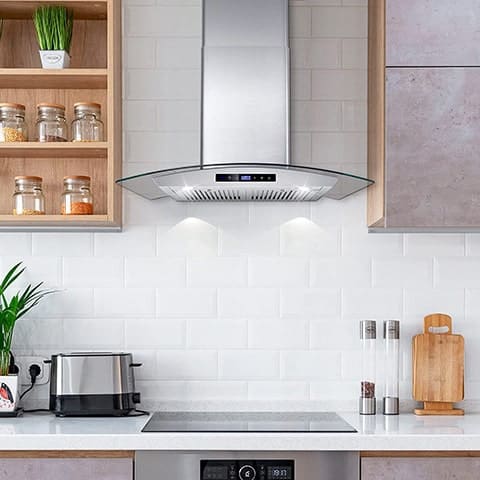 A kitchen view of the Cosmo 668WRCS75 (30") Chimney Range Hood for our Top 5 Wall Mount Chimney Range Hoods of 2022 listicle. The range hood is installed in a kitchen.