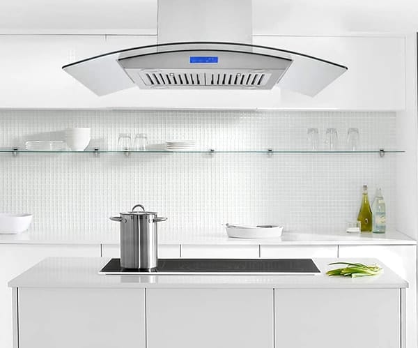 A kitchen view of the Tieasy Island Range Hood (36") island range hood for our Top 3 Best Island Range Hoods of 2023 listicle. The range hood is installed in a kitchen.