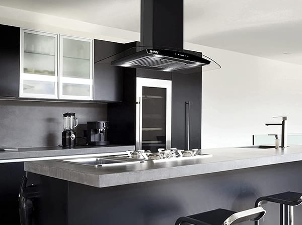 A kitchen view of the 2. AKDY AK-RH0481 (36") Chimney Range Hood for our The Top 3 Best Island Range Hoods of 2022 listicle. The range hood is installed in a kitchen.