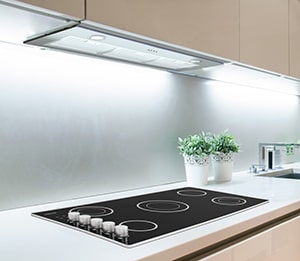 A kitchen view of the Ancona Inserta Plus 36 Range Hood Insert for our Top 3 Best 36 Range Hood Insert of 2021 listicle. The range hood is installed in a kitchen.