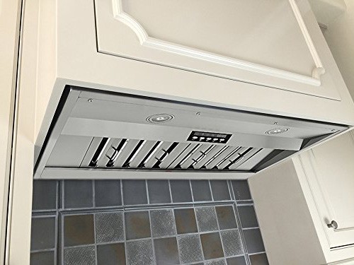 A kitchen view of the KOBE Deluxe IN2636SQB-650-5 36 Range Hood Insert for our Top 3 Best 36 Range Hood Insert of 2021 listicle. The range hood is installed in a kitchen.