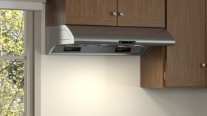 Kitchen shot of the Zephyr AK2100BS under cabinet range hood. It's integrated in the kitchen and installed under a brown cupboard.