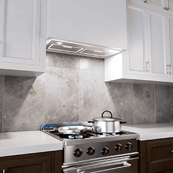 A kitchen short of the FIREGAS FGS-USB22Y72AC (28) - header range hood insert. The range hood has two mesh filters and two LED lights. There are pots underneath the range hood on the range. The cabinets are colored white.